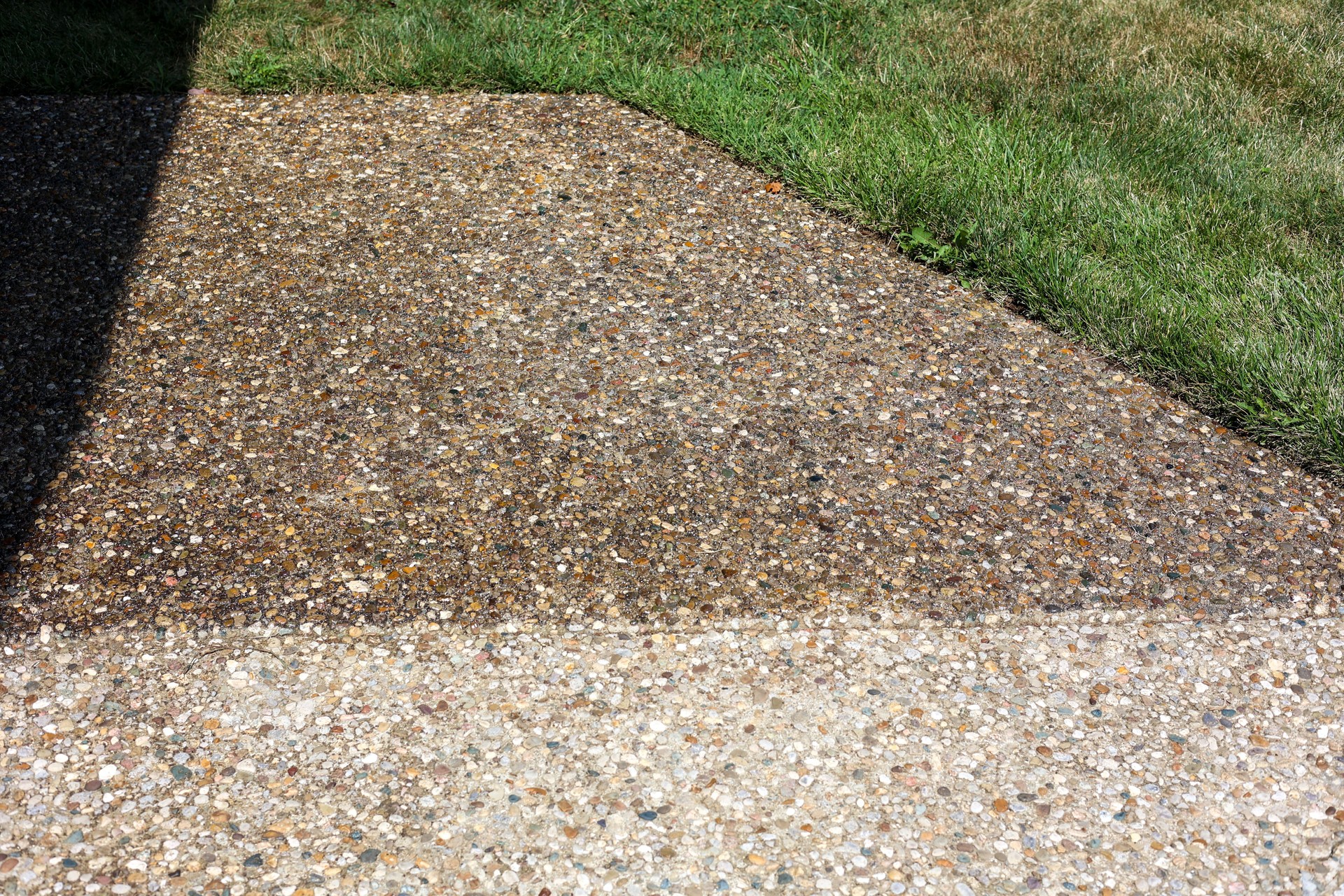 Clear Sealing concrete  on sidewalk in front of a home